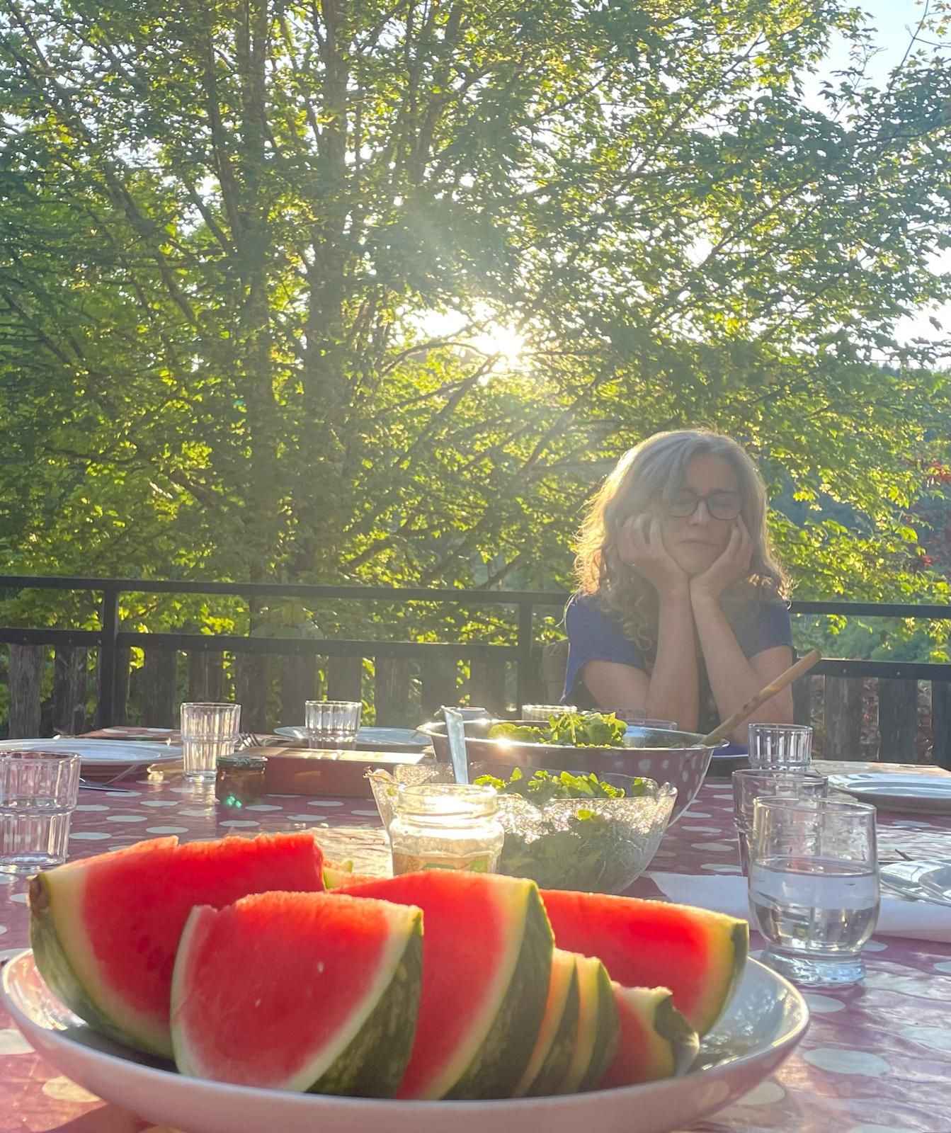 A shared break on the terrace in golden light