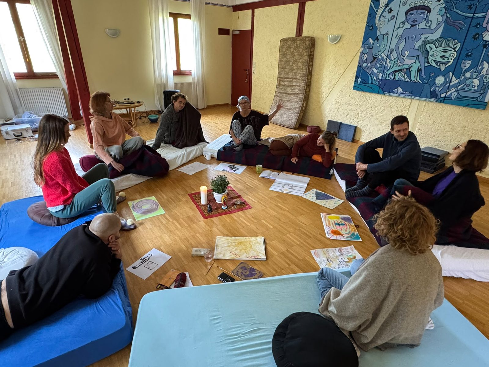 Participants working on the floor of the seminar hall