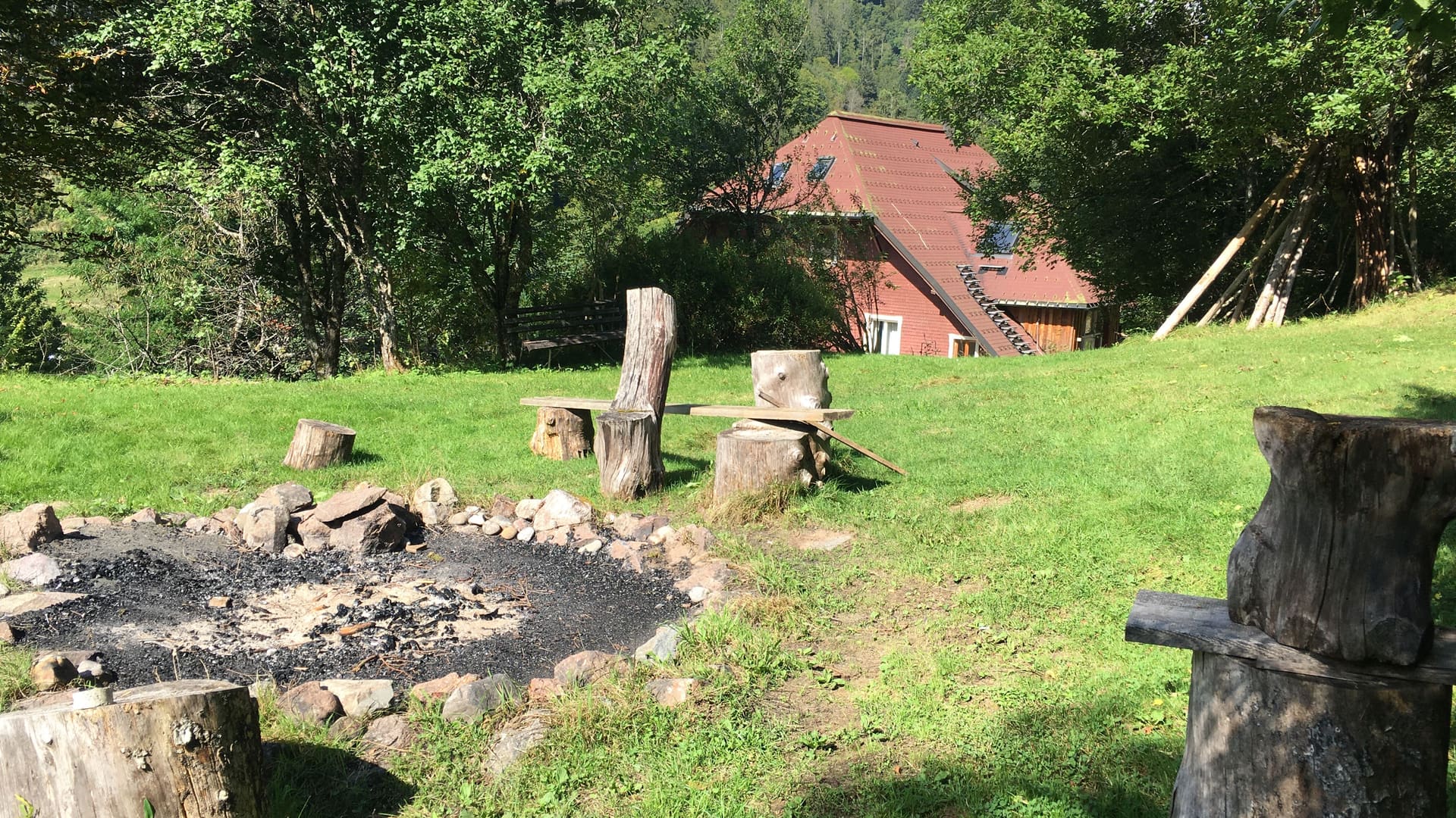The seminar house at Todtmoos among the Black Forest trees, seen from the garden fire circle