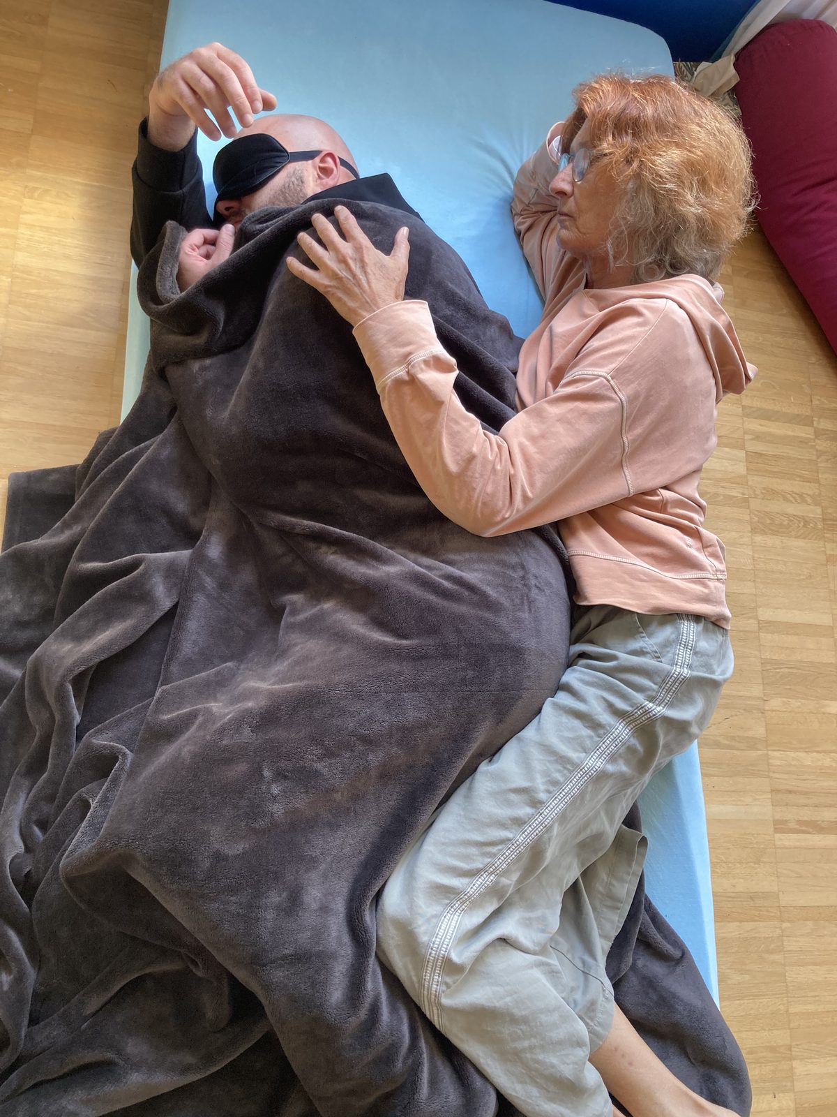 A facilitator holding a participant at the end of a session
